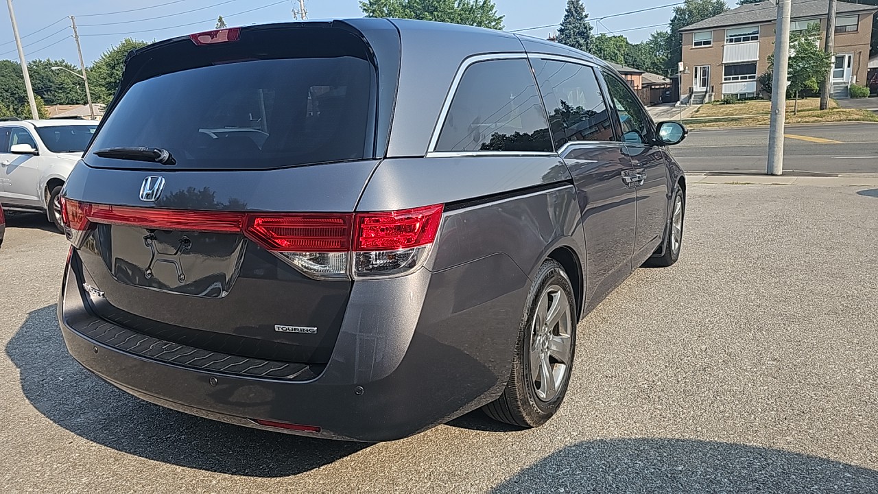 2015-Honda Odyssey Touring/Fully Loaded/Navigation/DVD/All Doors are Power/Leather Seats/Heated Seats/Power Seats/Sun Roof/Fog Lights. $15789.00